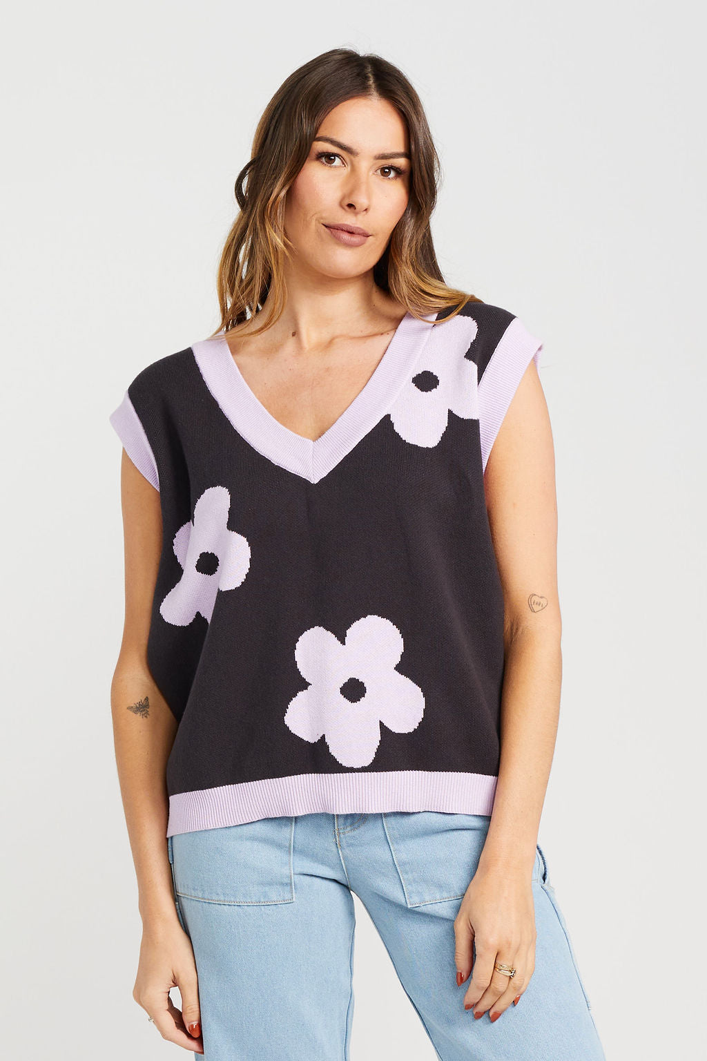 Thing Thing Bloom vest in a coral lilac colour. The floral pattern is great for spring and summer