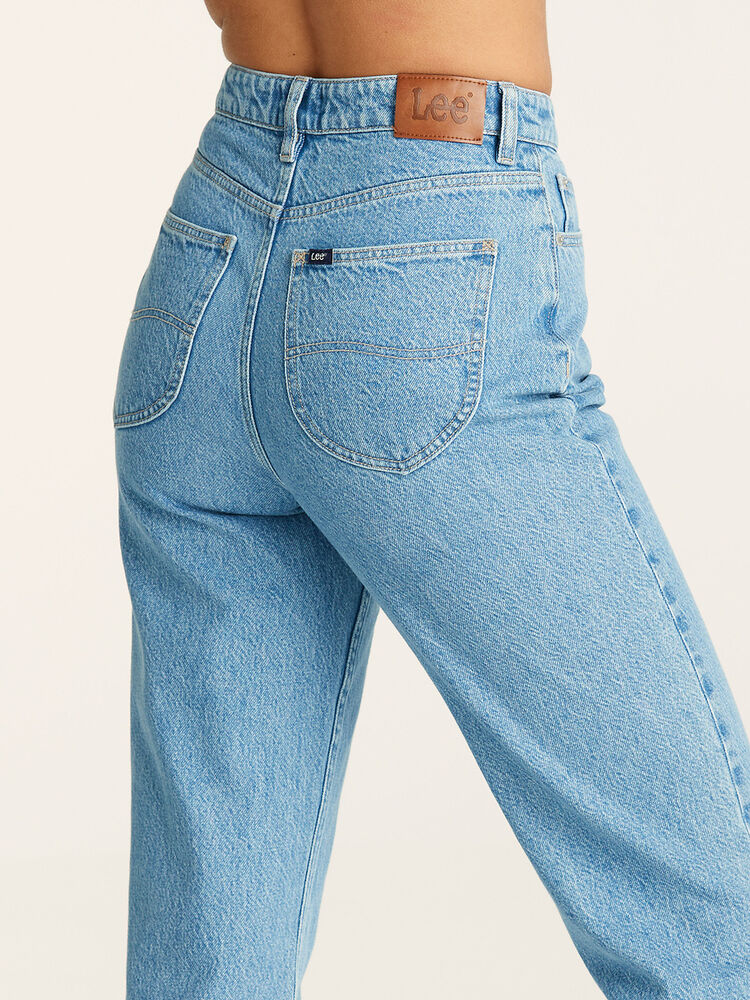 Above the ankle and high rise blue jeans. petite length