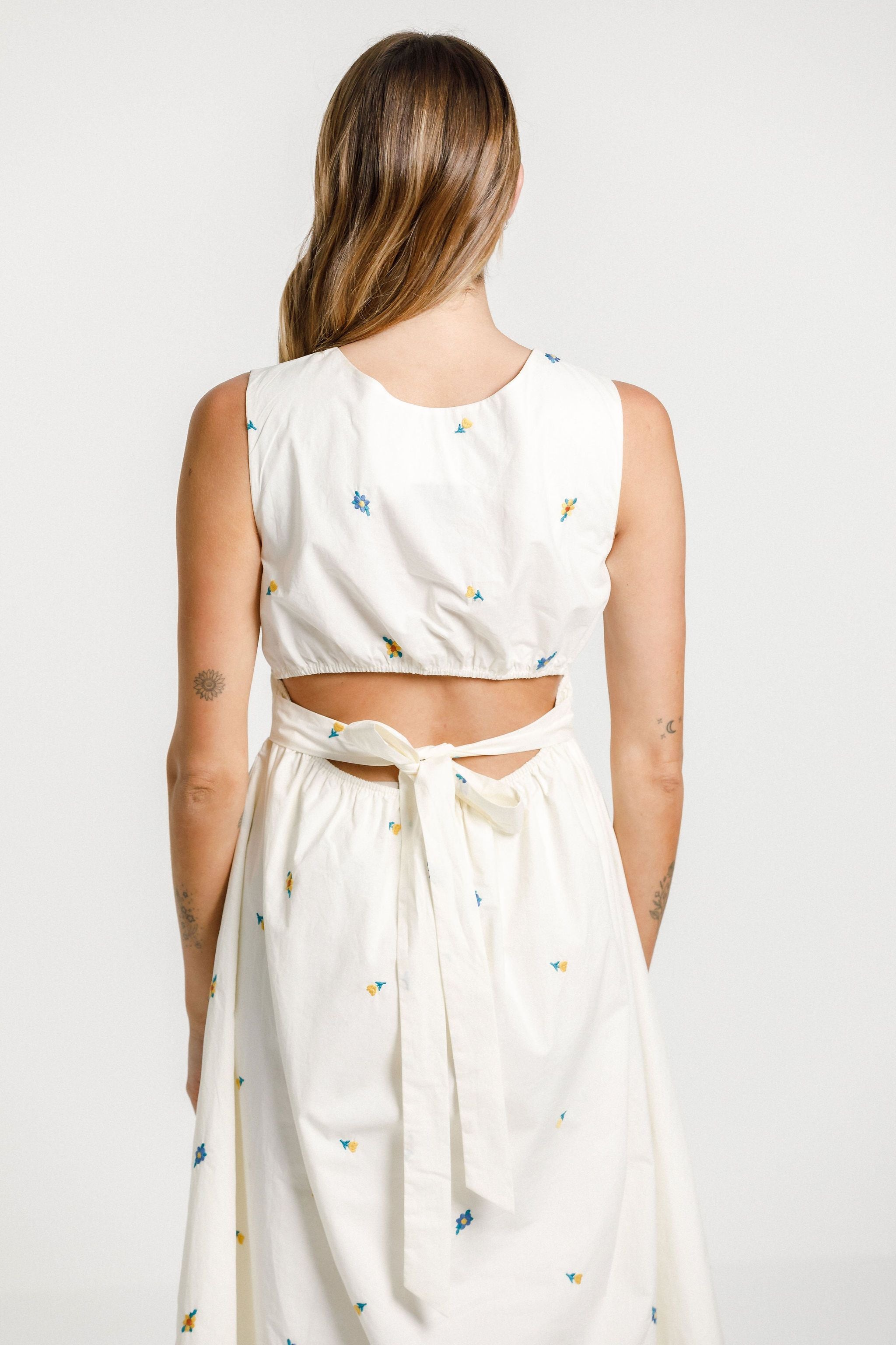 long white dress with flowers and basck cut out