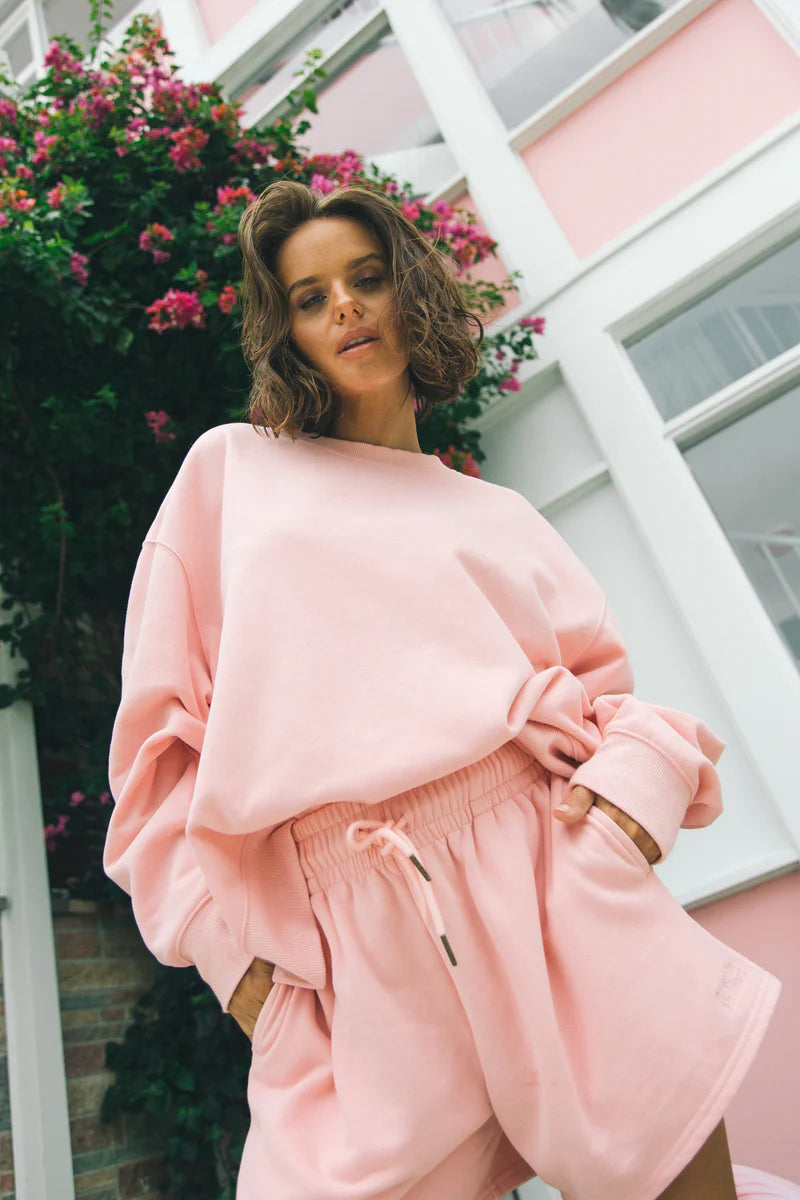 A relaxed fit pink sweatshirt from Charlie Holiday
