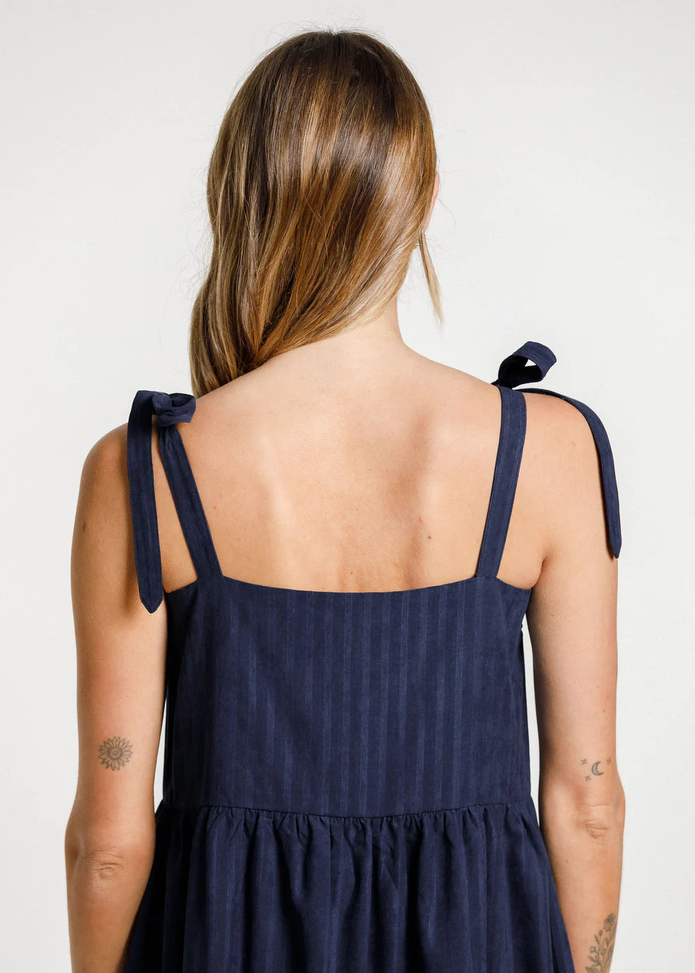 Women's navy blue dress from Thing Thing with square cut front, gathered layers and deep pockets