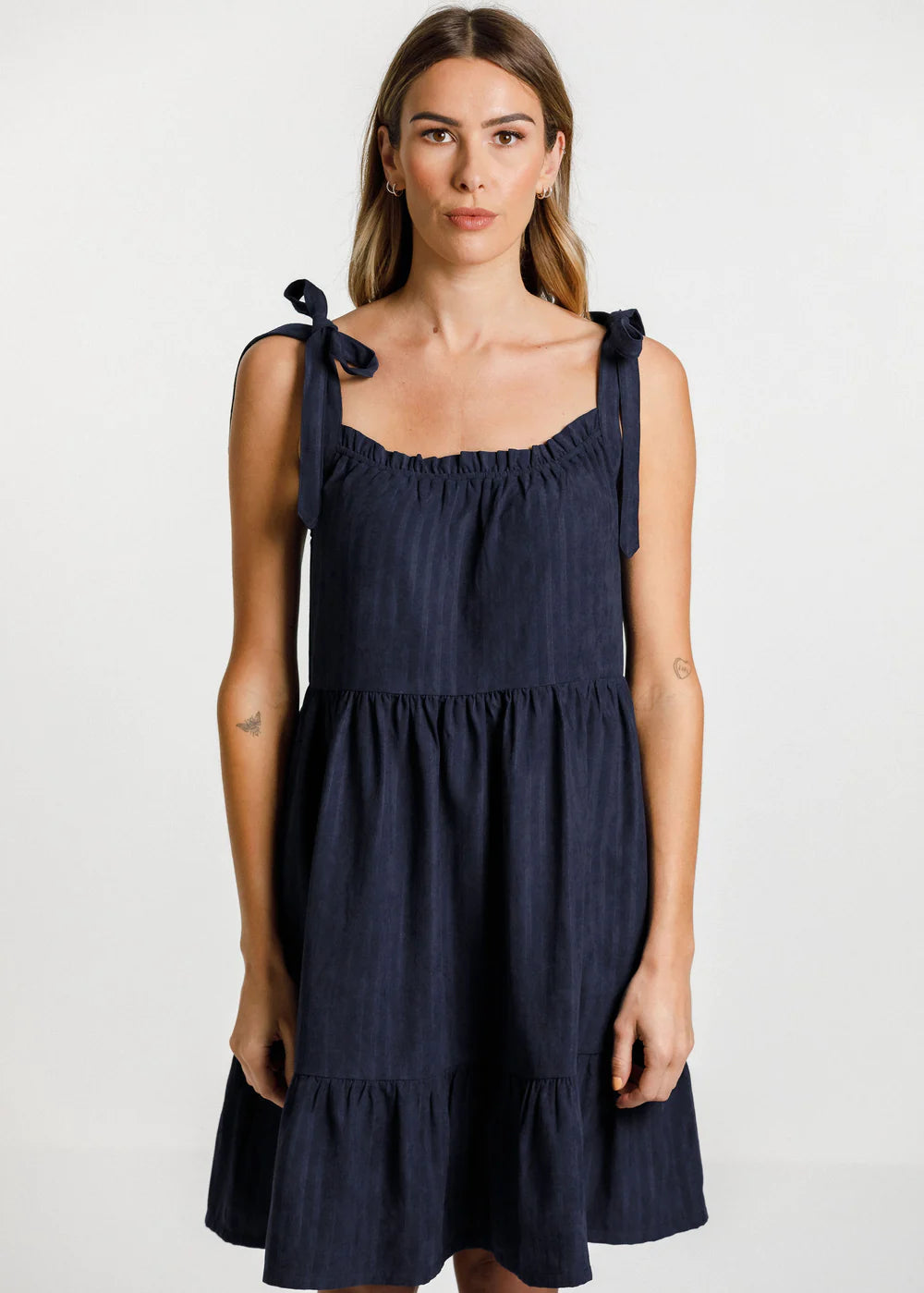 Women's navy blue dress from Thing Thing. Zig dress with square cut front, gathered layers and deep pockets