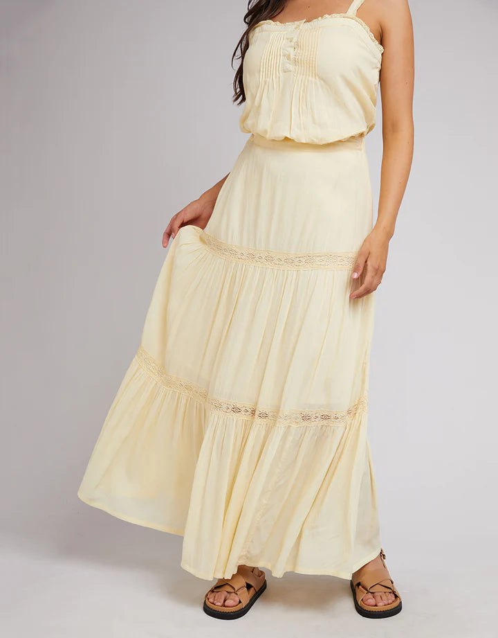 Yellow All About Eve maxi skirt with a fixed waistband with elastic at the back, lace trims, and a tiered hem