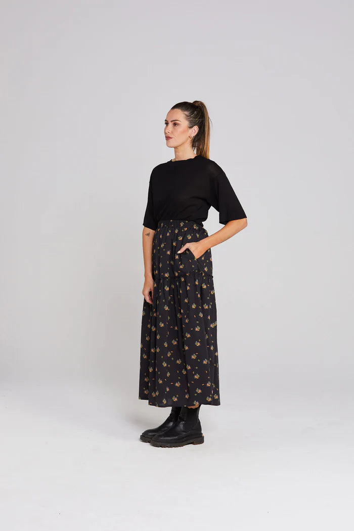 Black with florals. Midi length with pockets
