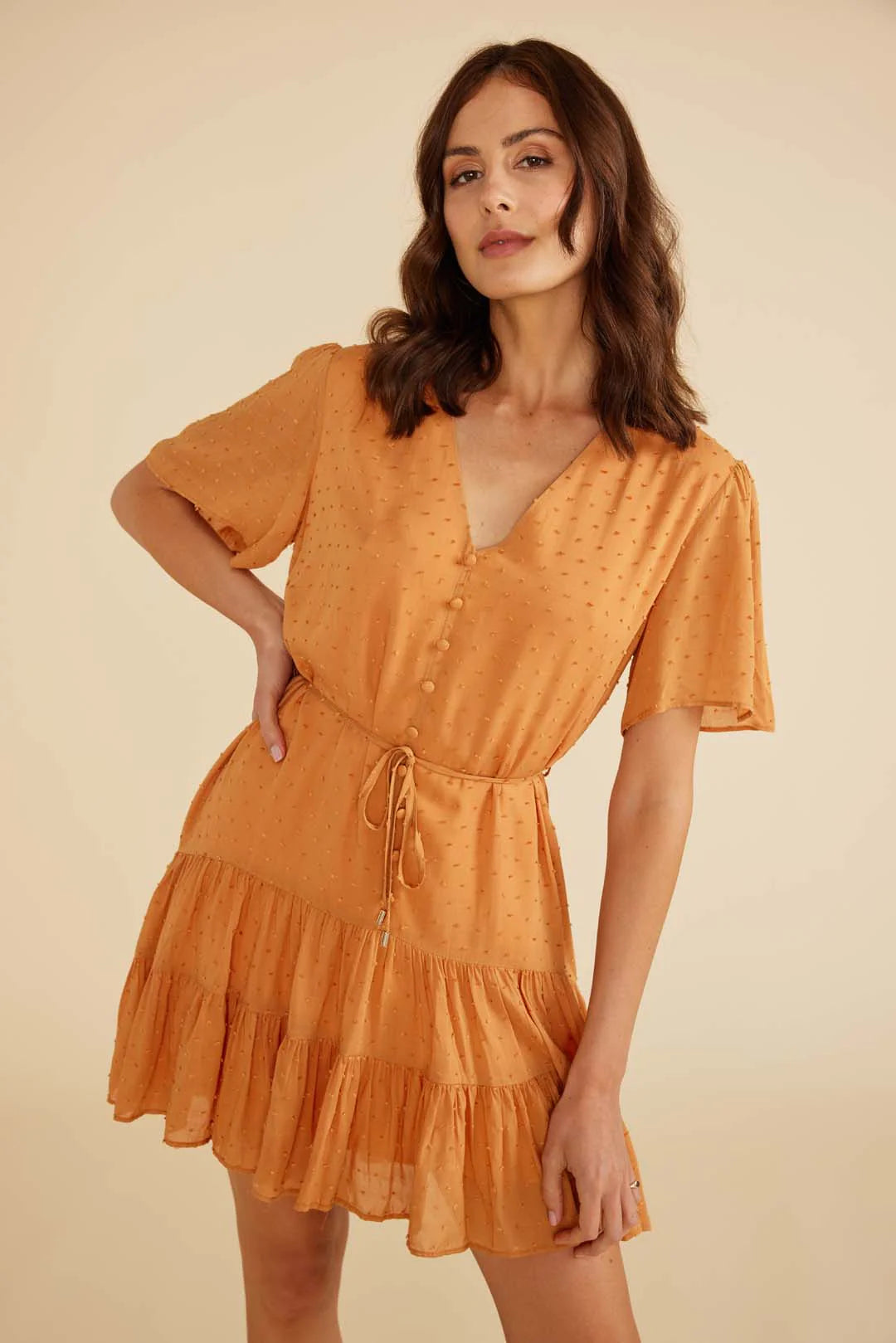 Dahlia mini dress from Minkpink withV neckline, flowy sleeves
Tie strap at waist New Zealand