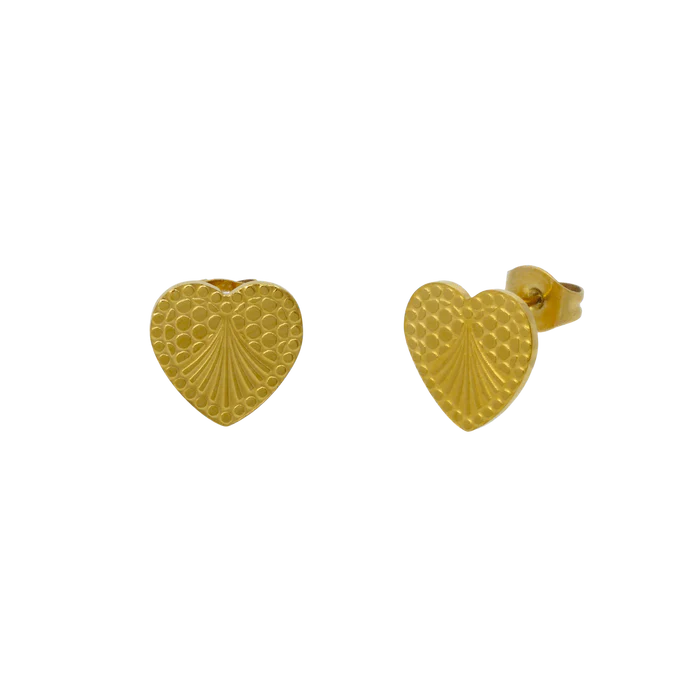 gold heart-shaped earrings with an engraved abstract design.