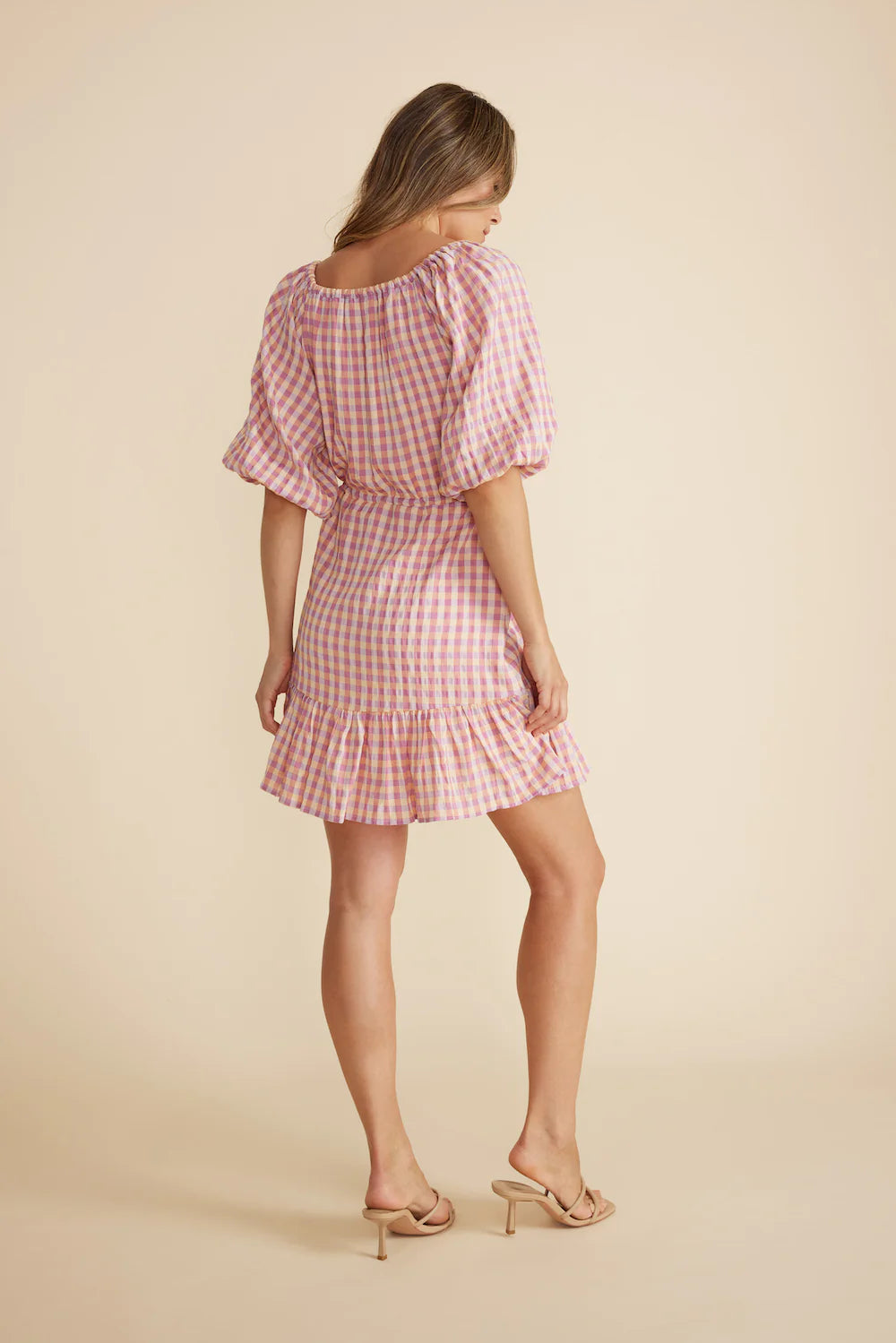 Scoop neckline with V cut out
From Minkpink with v neck,
Short puff sleeves with elastic cuffs and draw-string waistband