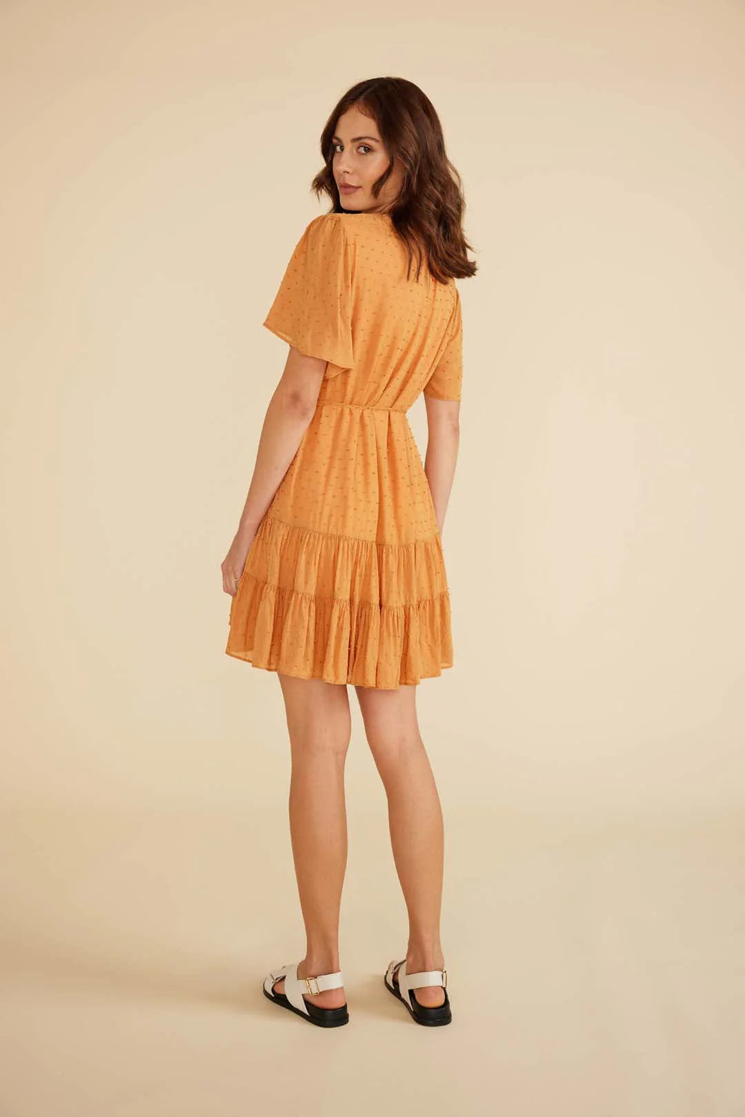 Dahlia mini dress from Minkpink withV neckline, flowy sleeves
Tie strap at waist New Zealand