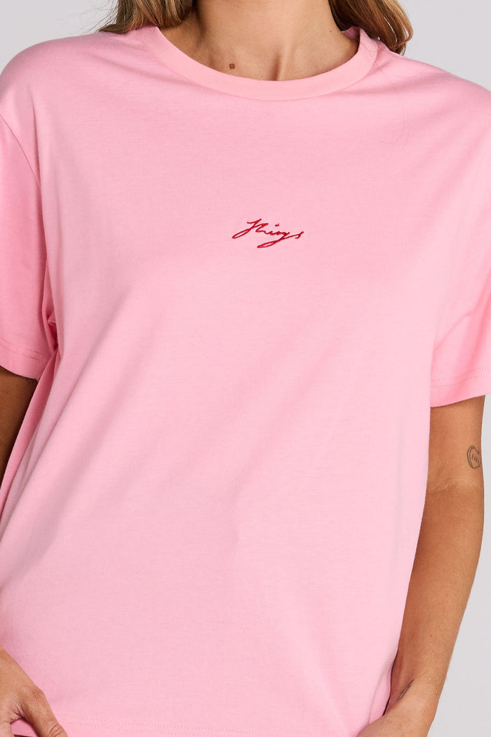 A classic fit boxy silhouette pink tee for ultimate comfort. Finished with contrast embroidery