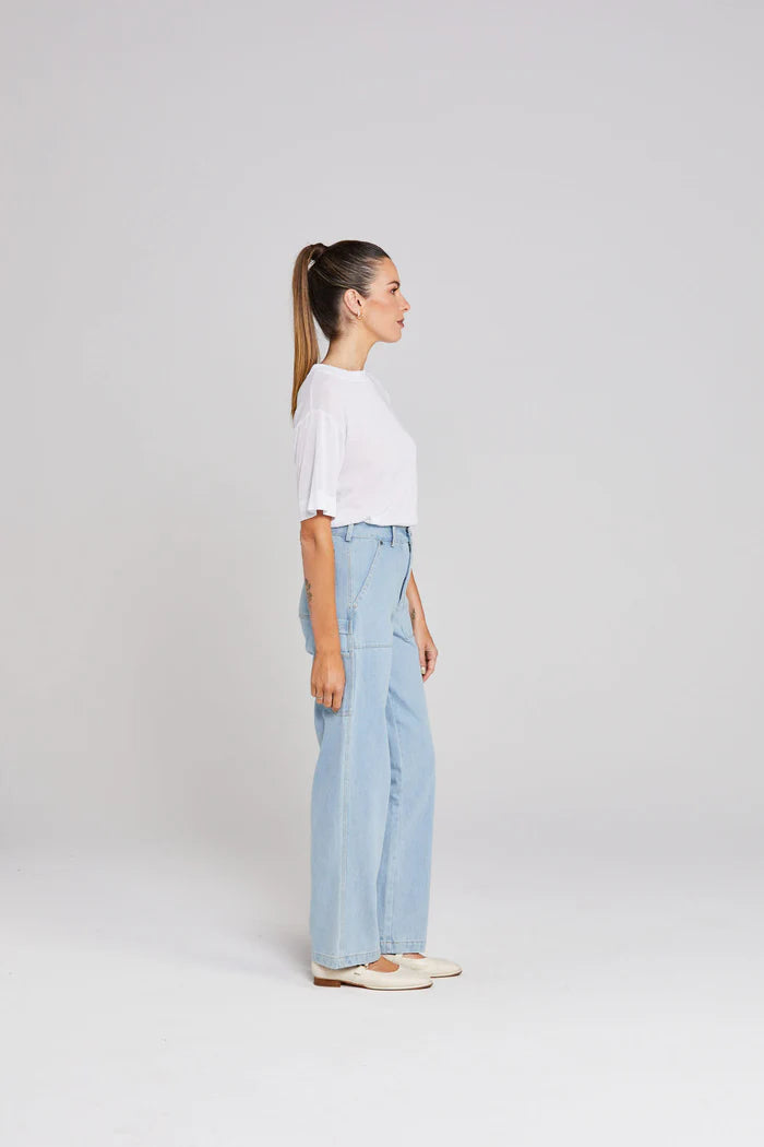 cotton stretch denim and pockets, carpenters loop, rivets, zip fly with tack closure, and belt loops.