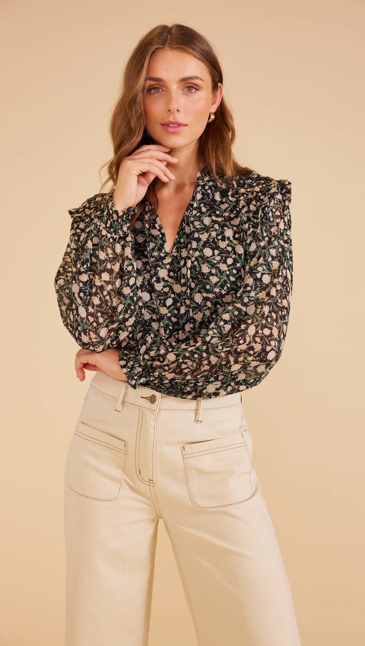 sheer full-length blouson sleeves with elastic cuffs, V-neck opening with self-ties relaxed shape and
lined bodice