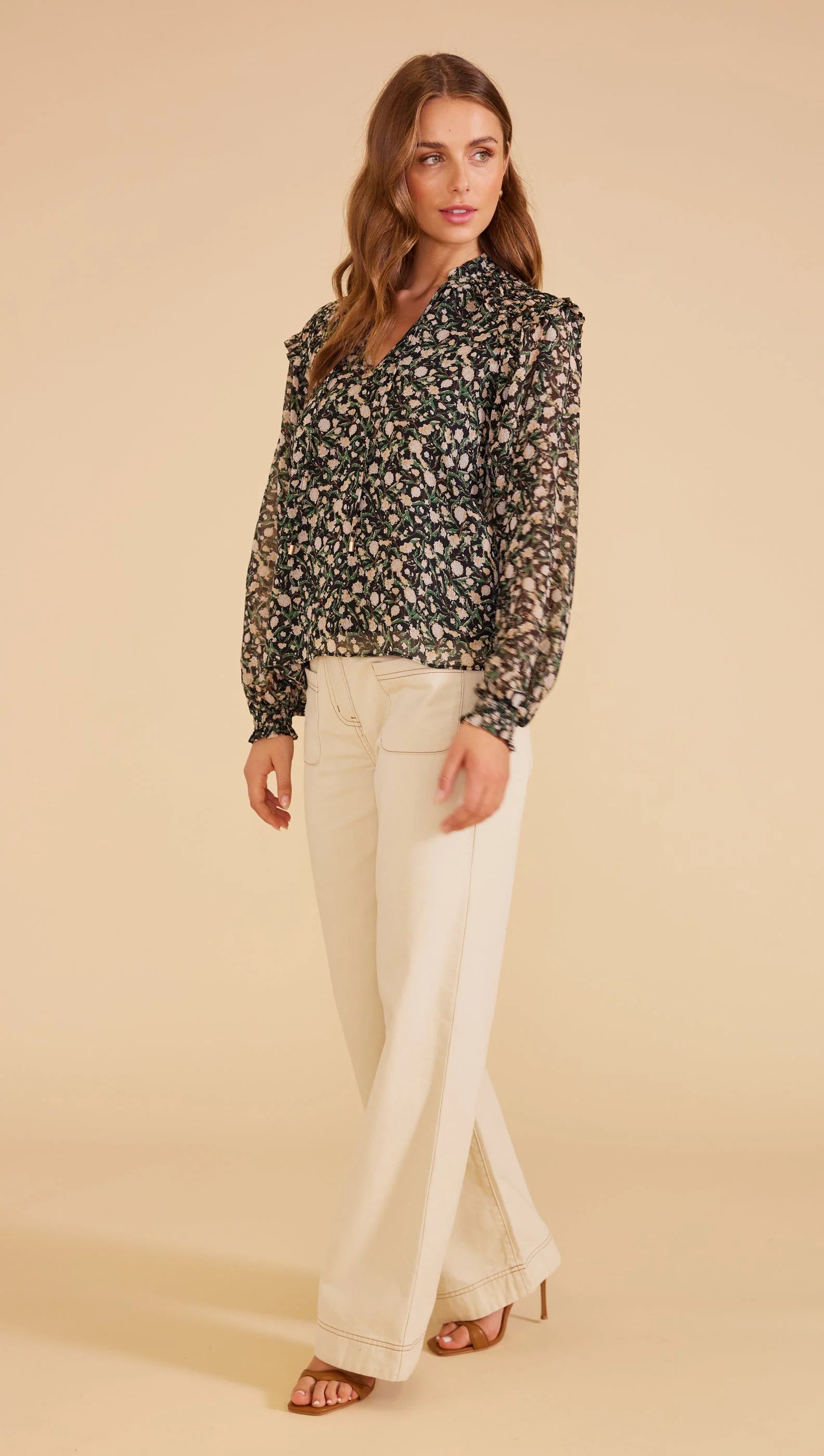sheer full-length blouson sleeves with elastic cuffs, V-neck opening with self-ties relaxed shape,
lined bodice