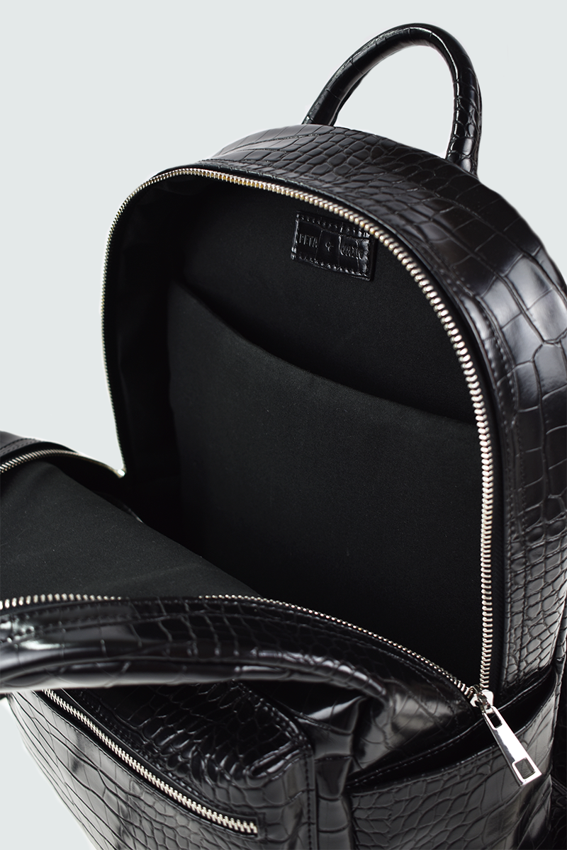 a top handle, laptop compartment vegan embossed leather