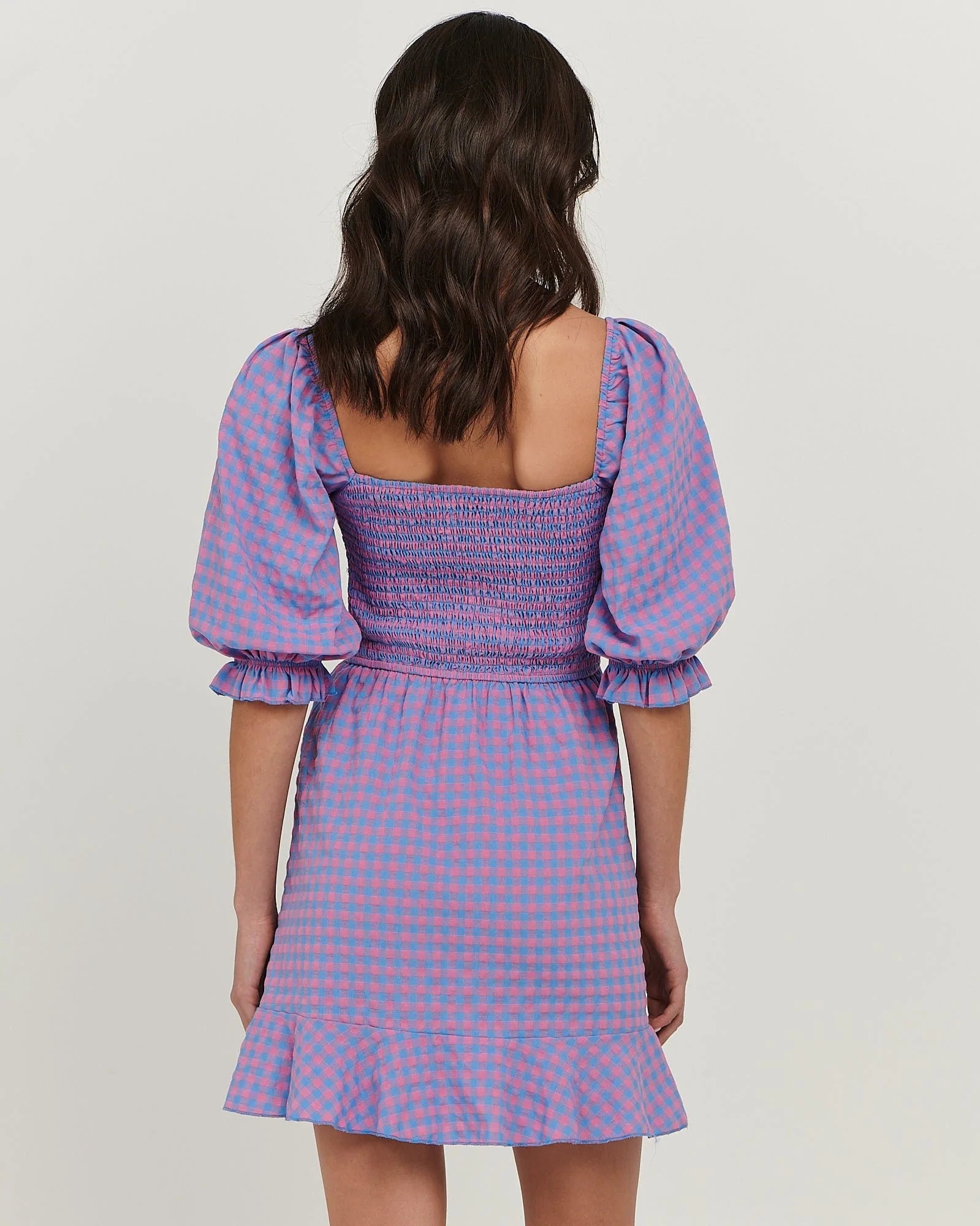 Puff sleeve cotton mini dress with
shirred bodice; straight neckline; flared skirt with frill at hem