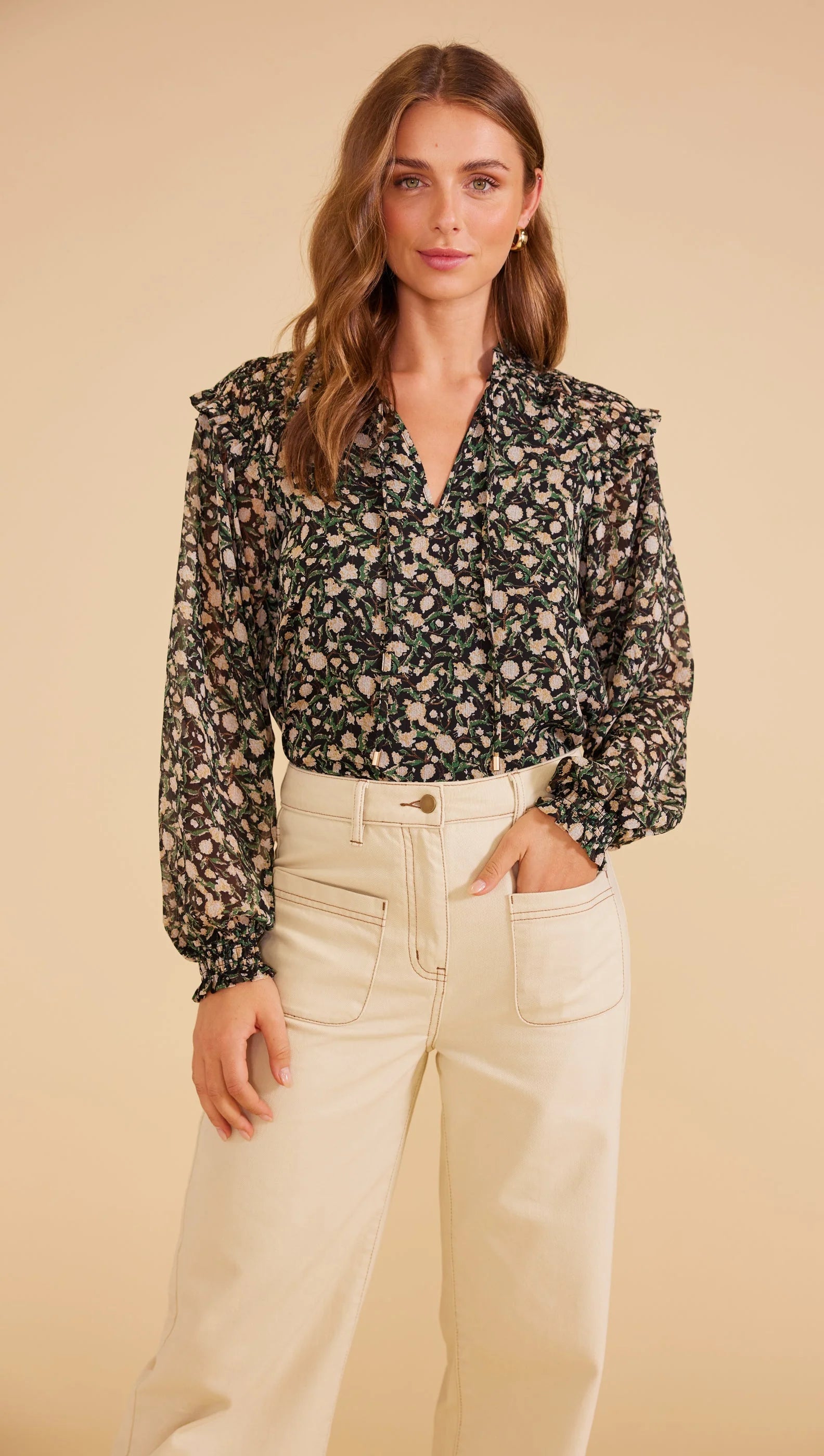 sheer full-length blouson sleeves with elastic cuffs, V-neck opening with self-ties relaxed shape,
lined bodice
