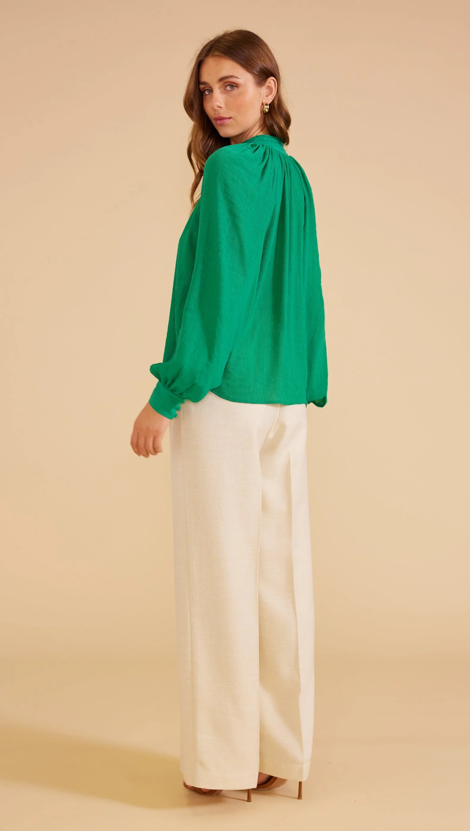 green blouse, long sleeves and relaxed fit