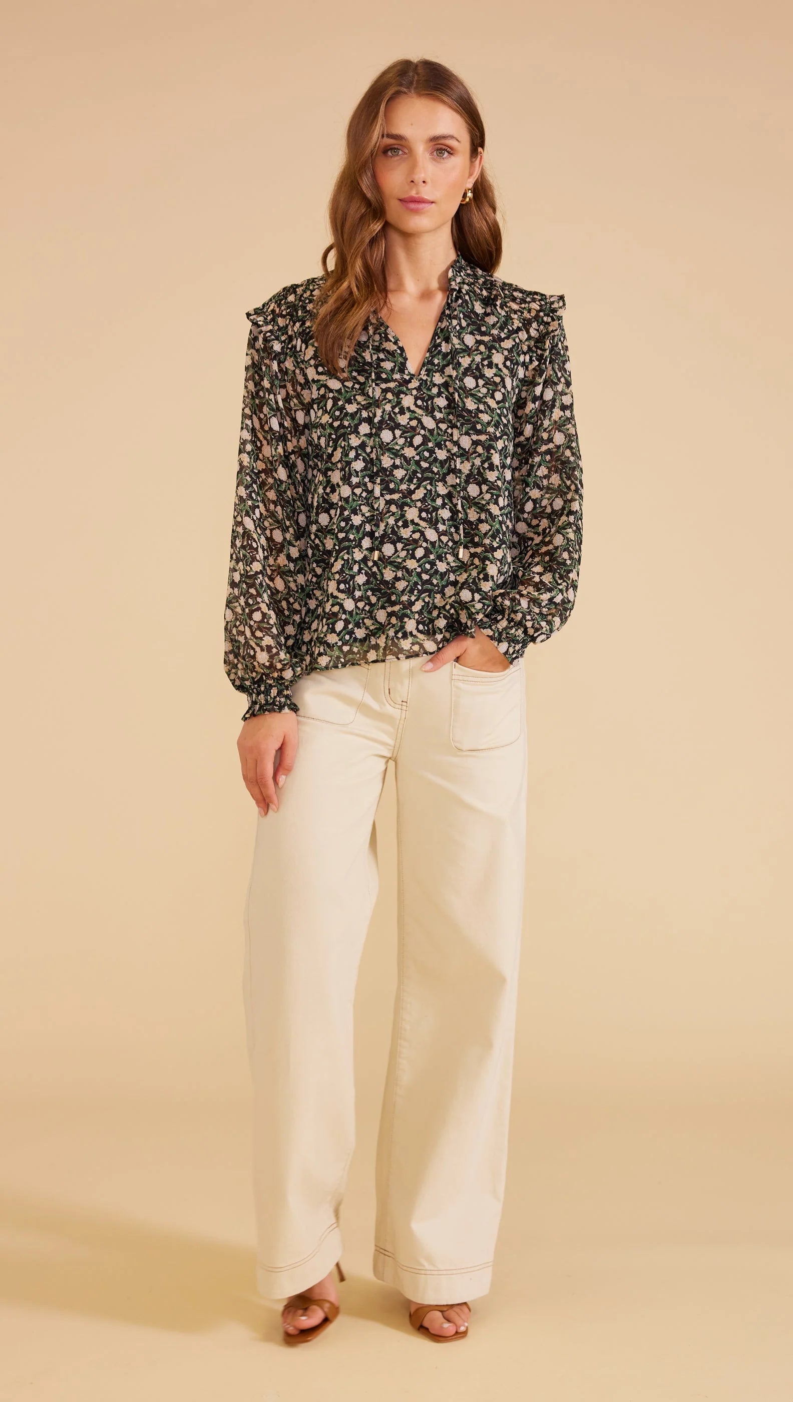 sheer full-length blouson sleeves with elastic cuffs, V-neck opening with self-ties relaxed shape,
lined bodice