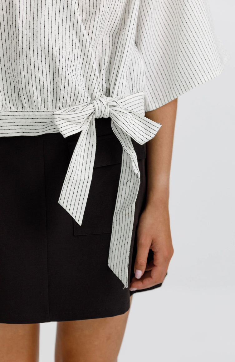 Izzy top with a wrap front, delicate tie, 3/4 sleeves and a deep v neckline