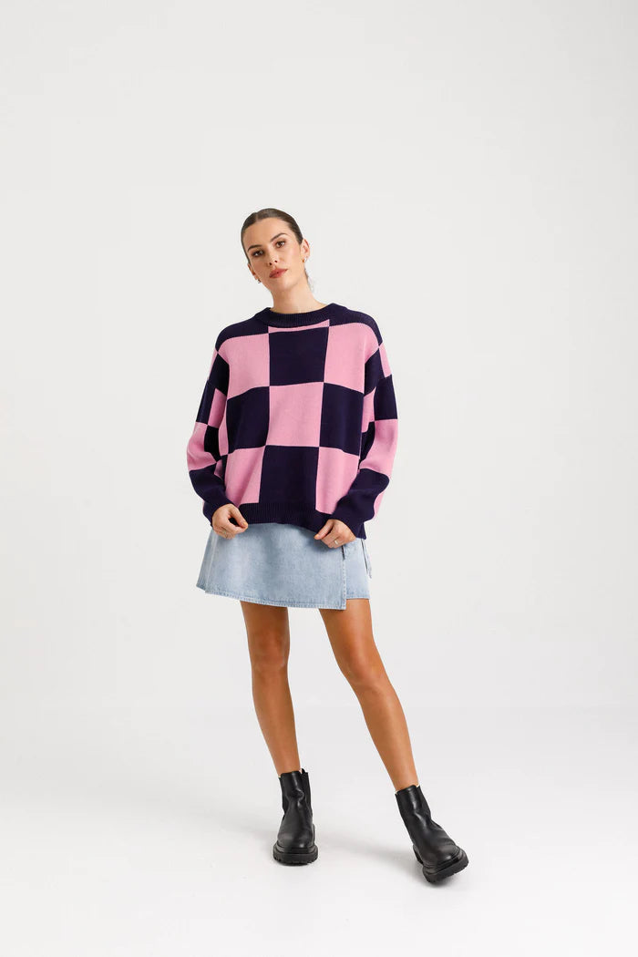 Cotton knit jumper with check print. Navy blue and pink checks