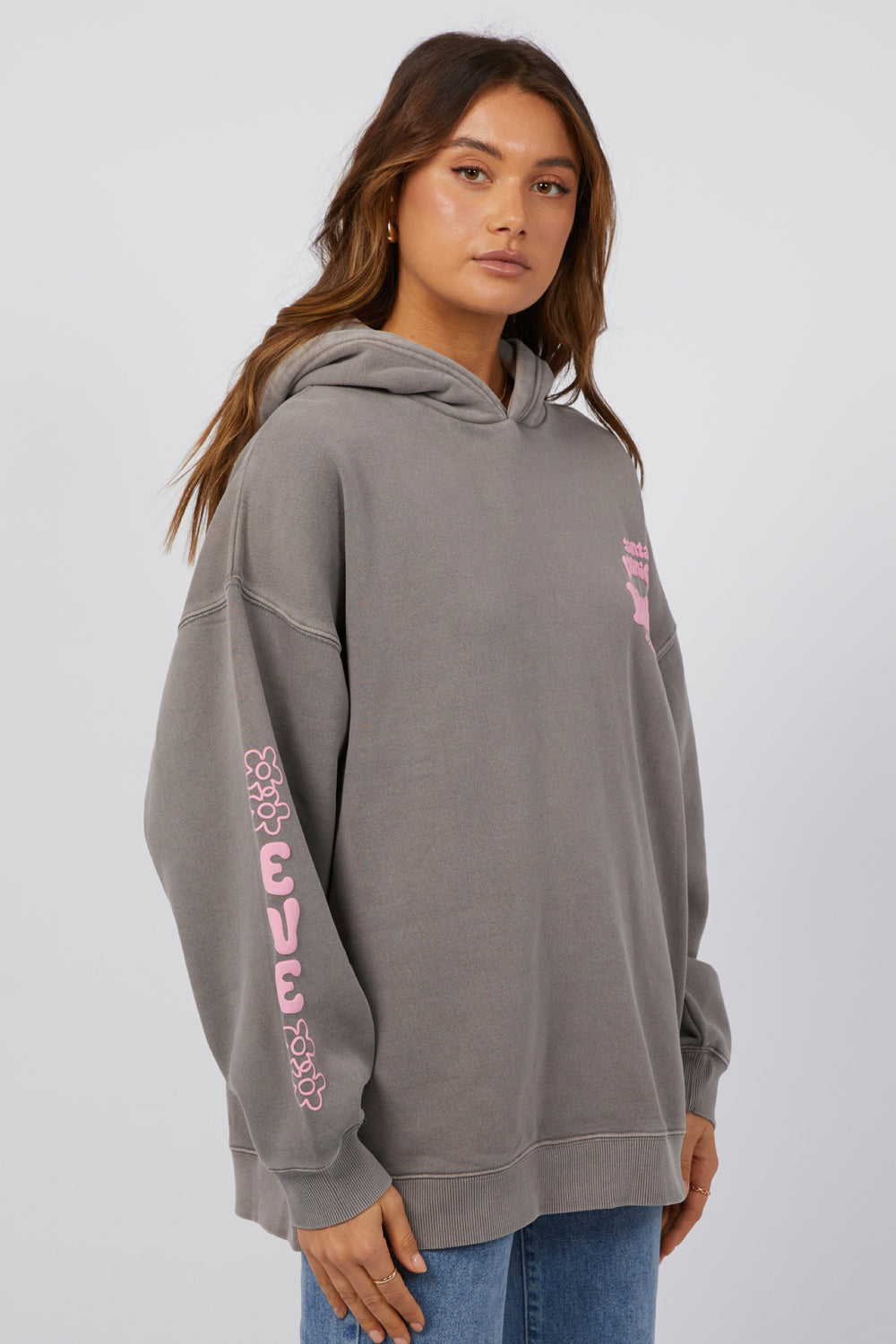 Grey oversized sweatshirt with pink logo. All About Eve branding