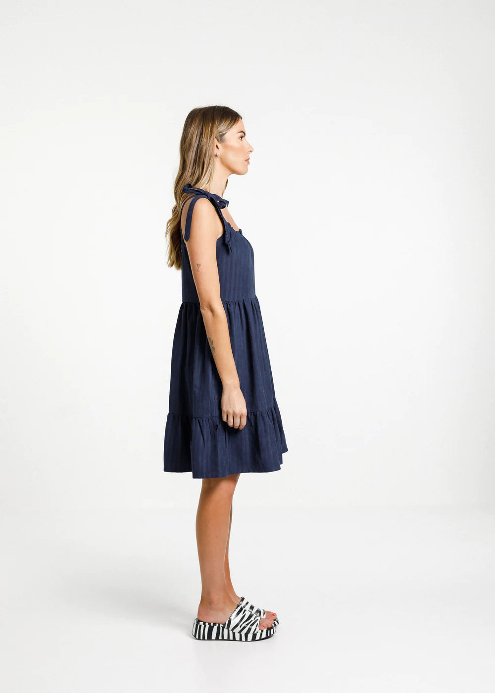 Women's navy blue dress from Thing Thing with square cut front, gathered layers and deep pockets