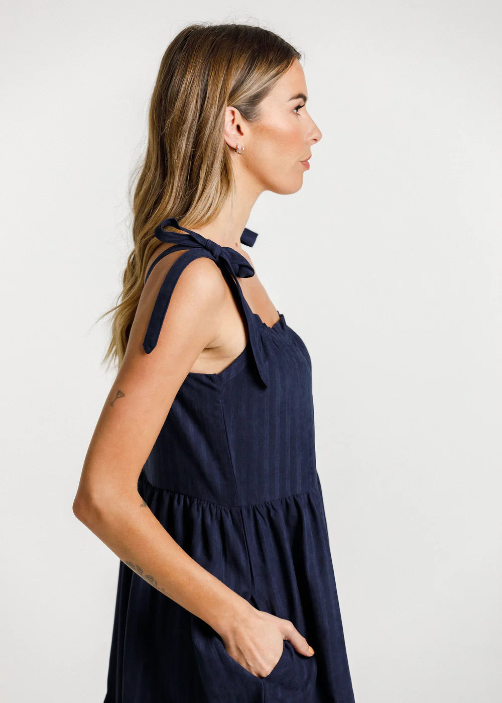 Women's navy blue dress from Thing Thing with square cut front, gathered layers and deep pockets