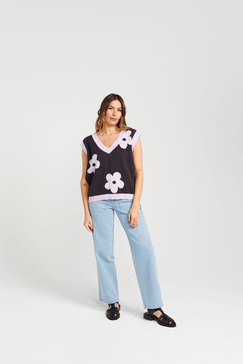 Women's navy blue vest with purple flowers