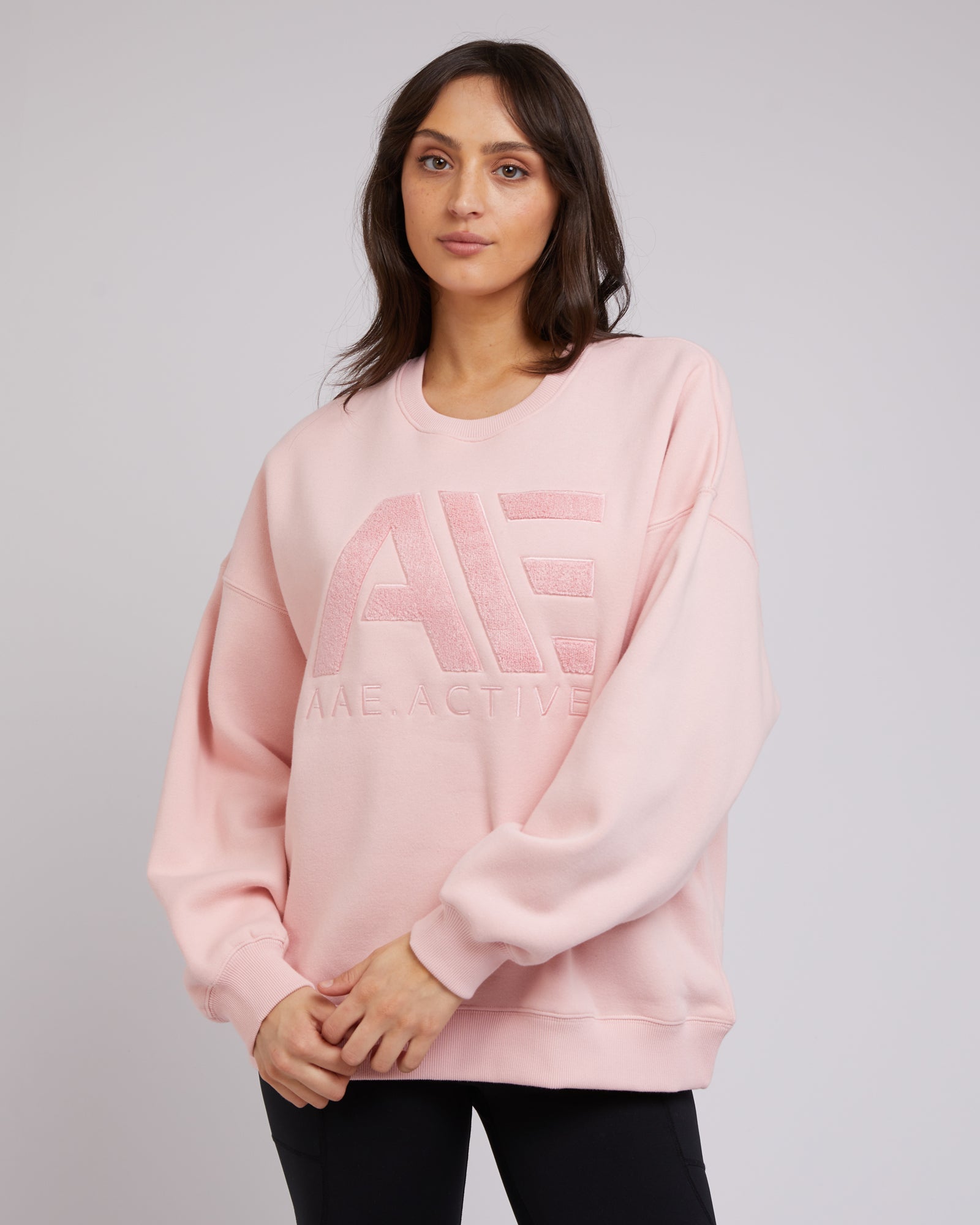 Pink sweatshirt, oversized fit andAAE branding New Zealand