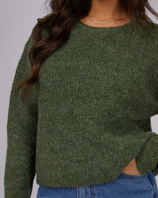 womans green jumper in mid length