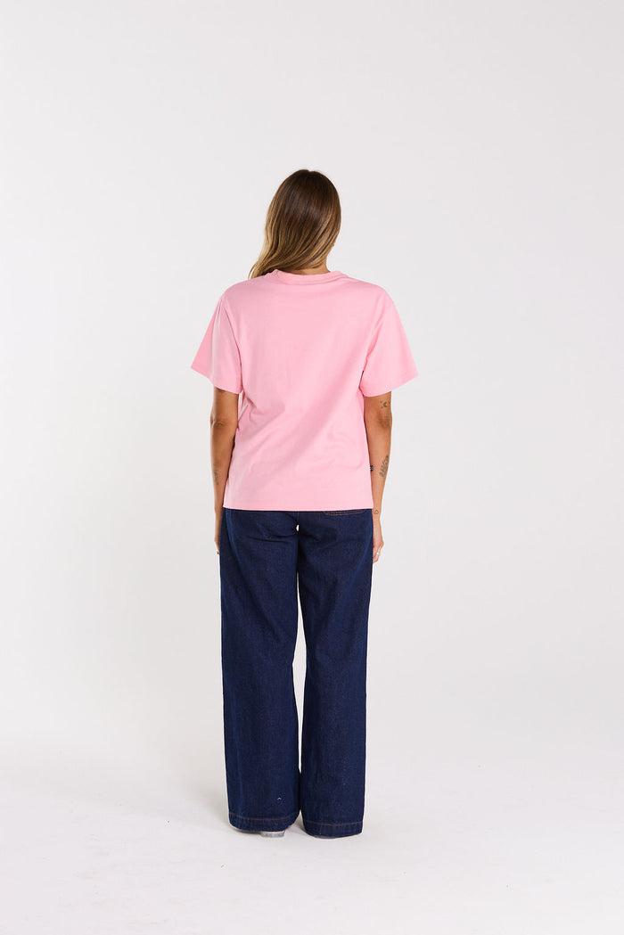 A classic fit boxy silhouette pink tee for ultimate comfort. Finished with  contrast embroidery  