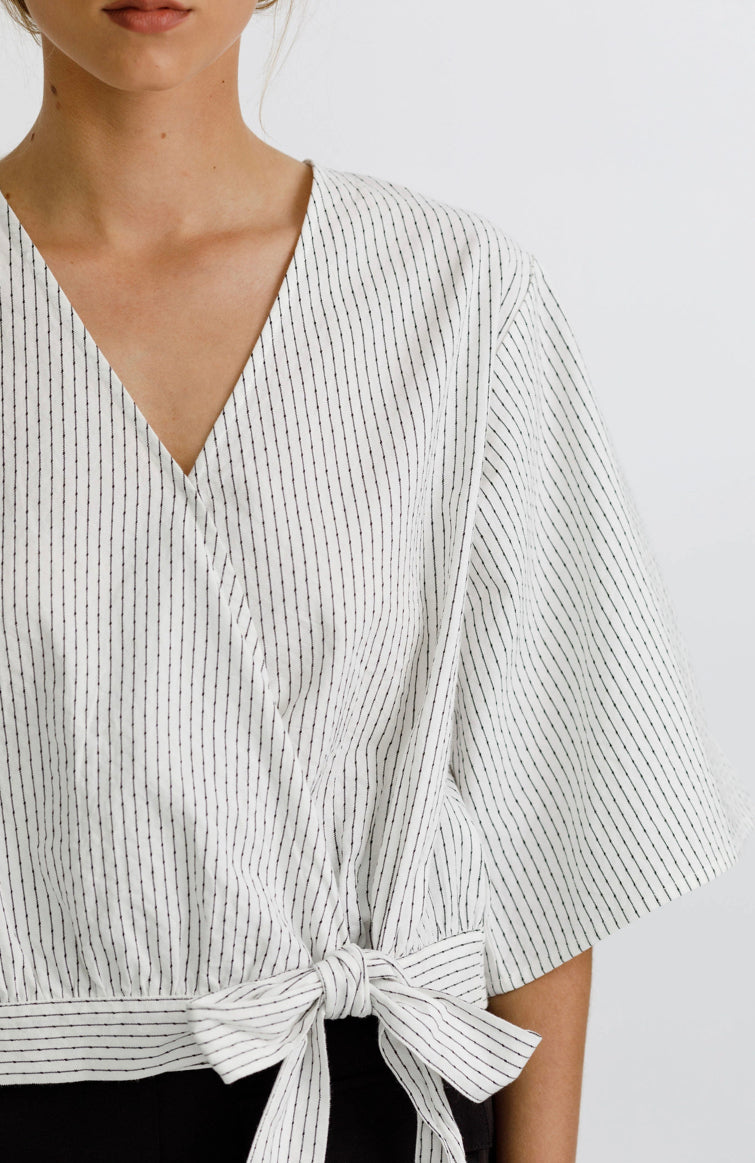 Izzy top with a wrap front, delicate tie, 3/4 sleeves and a deep v neckline 