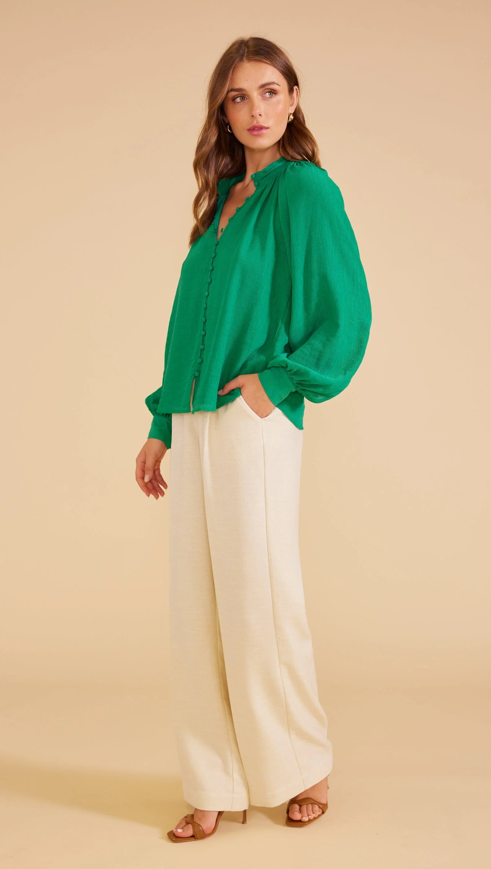 green blouse, long sleeves and relaxed fit