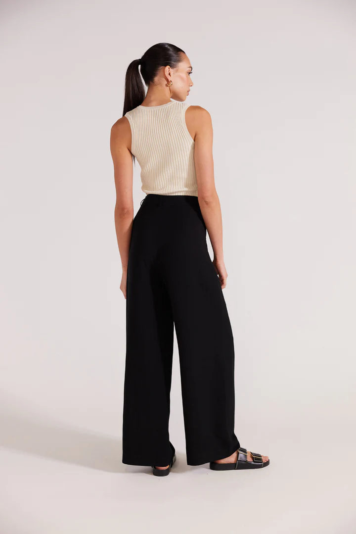 Black wide leg trousers, a high rise waistline, pockets and relaxed fit. staple the label Nw Zealand