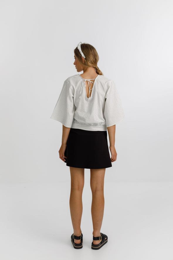 Izzy top with a wrap front, delicate tie, 3/4 sleeves and a deep v neckline 