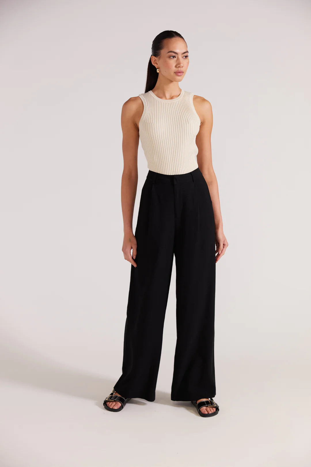 Black wide leg trousers, a high rise waistline, pockets and relaxed fit. staple the label Nw Zealand