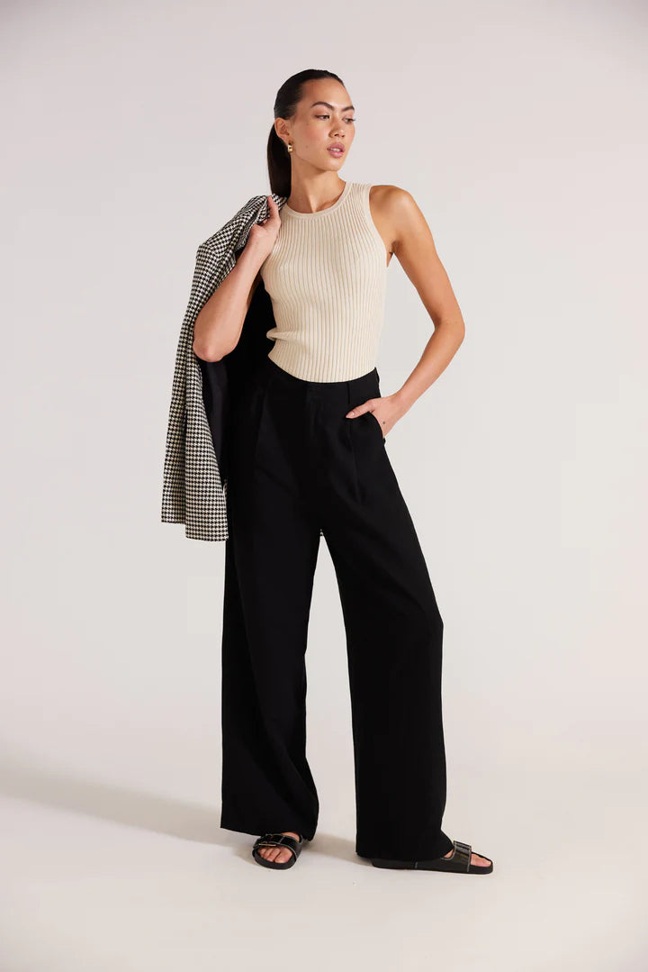 Black wide leg trousers, a high rise waistline, pockets and relaxed fit. staple the label Nw Zealand