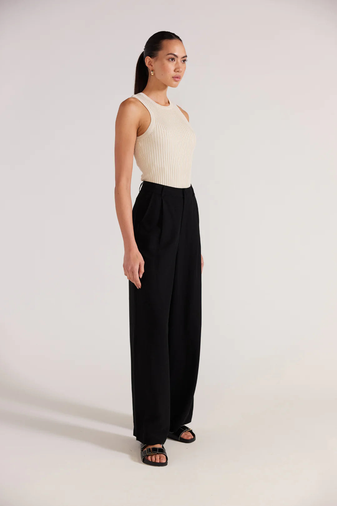 Black wide leg trousers, a high rise waistline, pockets and relaxed fit. staple the label Nw Zealand