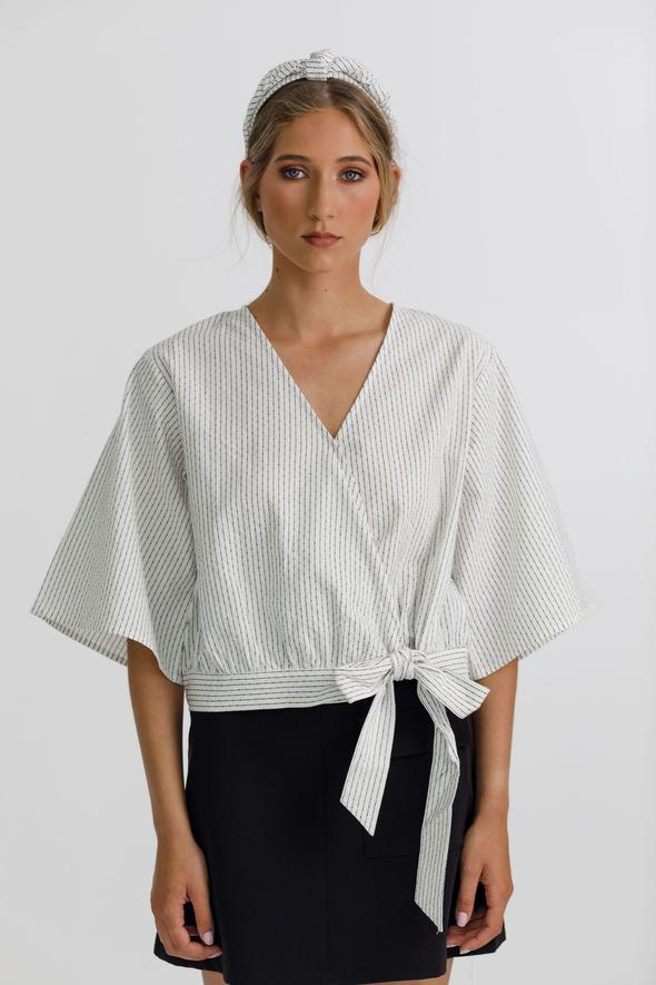 Izzy top with a wrap front, delicate tie, 3/4 sleeves and a deep v neckline 