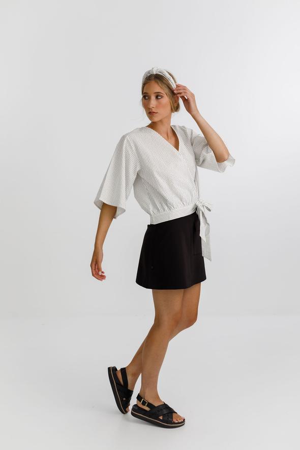 Izzy top with a wrap front, delicate tie, 3/4 sleeves and a deep v neckline 